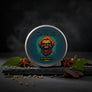 Skully's Savage Beard Balm container with a skull and beard design on a blue background