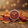Skully's Autumn Reserve beard balm container with skull and apple design on a red background