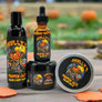 Skully's Pumpkin Jack skincare product set including body wash, oil, balm, and tin on a white background.