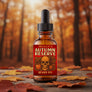 A 100ml amber glass dropper bottle of Skully's Autumn Reserve Beard Oil, featuring a black rubber dropper cap and a red label with a skull and orange graphic.