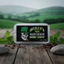 Skully's Solid Cologne Irish Mint packaging with a skull wearing a green top hat on a black background.