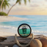 Skully's Marooned Beard Balm container with a skull and palm tree design on a green background.