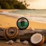 Skully's Marooned Beard Balm container with a skull and palm tree design on a green background.