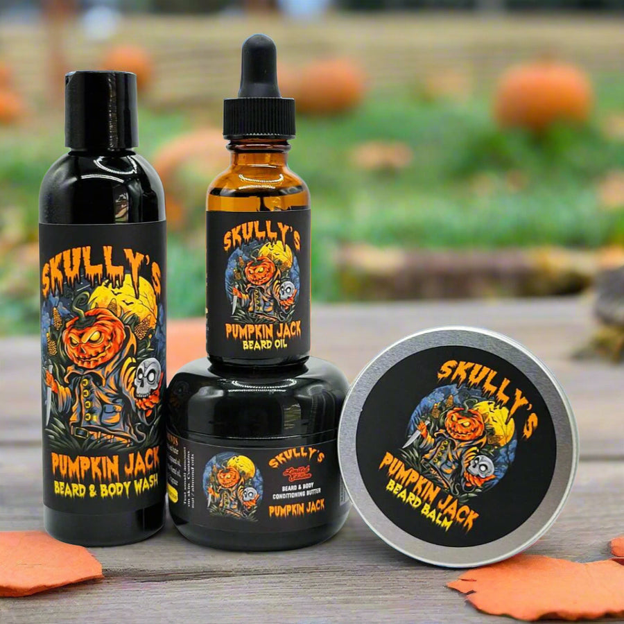 Skully's Pumpkin Jack skincare product set including body wash, oil, balm, and tin on a white background.
